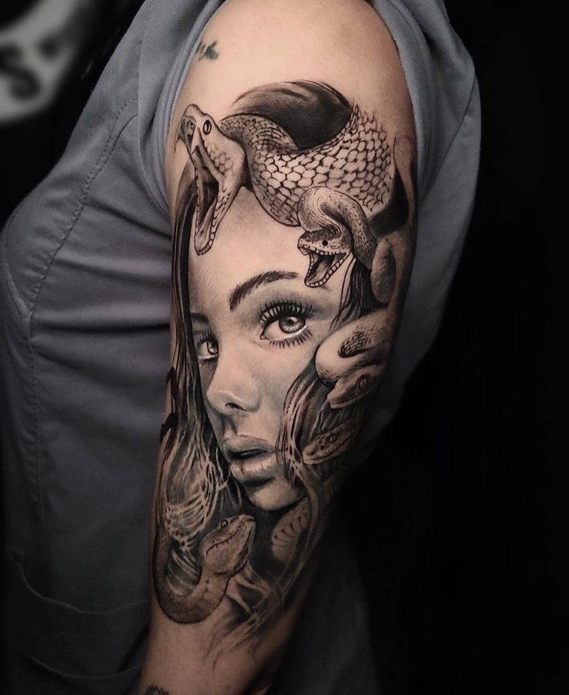 Medusa portrait tattoo, upper arm