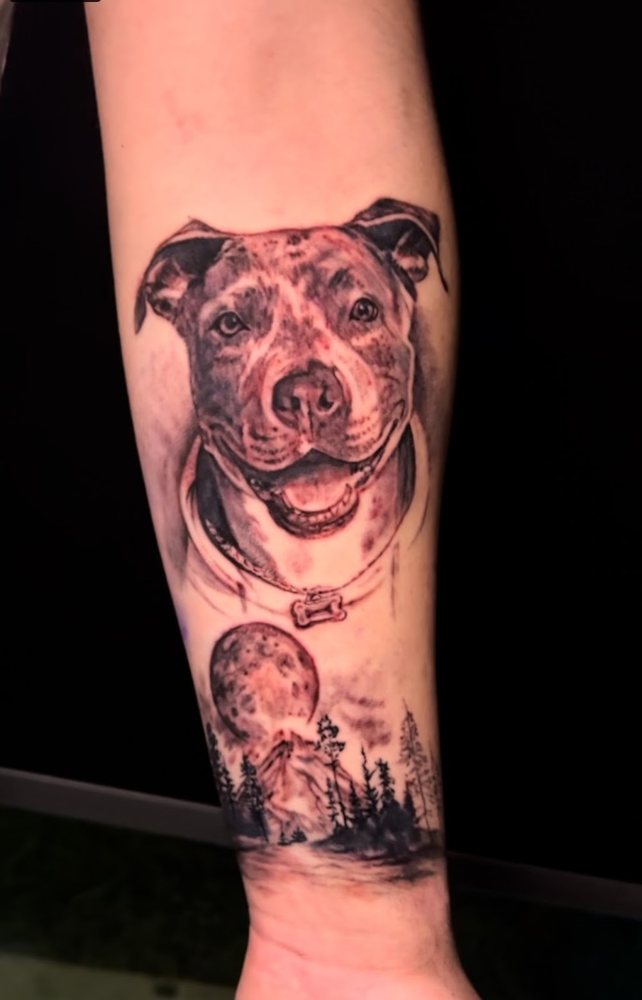 Pitbull portrait with moonlit forest, forearm